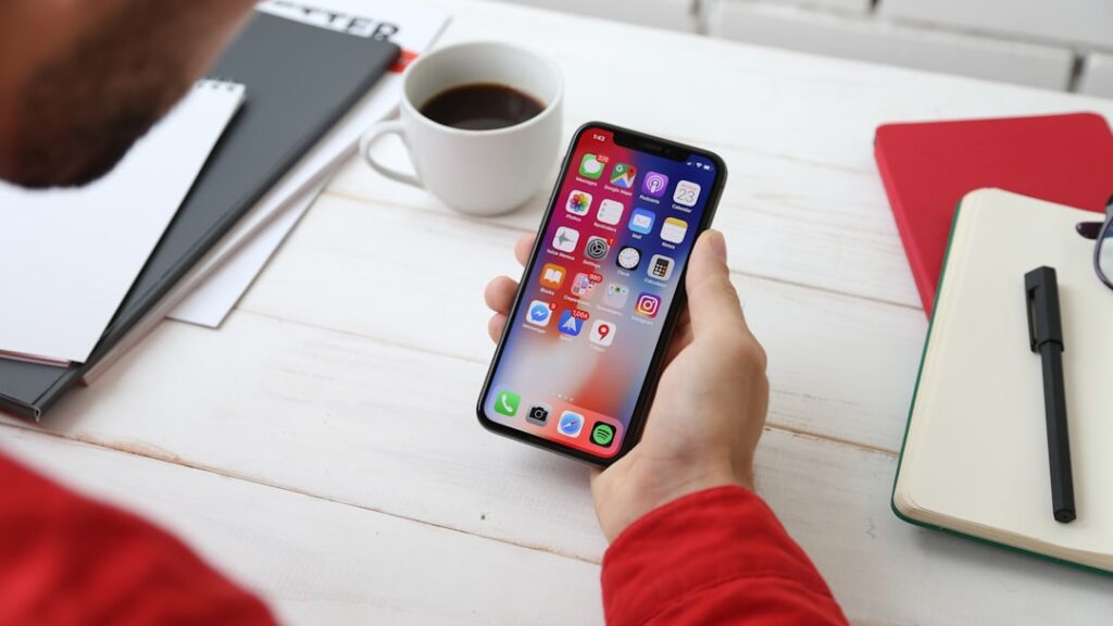 Person using smartphone to apply online