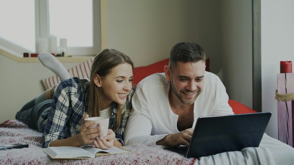 Couple in their 40s reviewing financial plans together